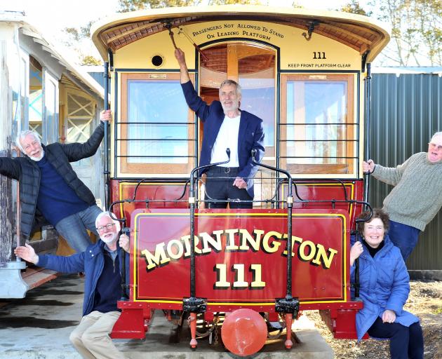 Celebrating the delivery of cable cars to Mornington are (from left) Trevor Goudie, Mac Gardner, Neville Jemmett, Claire Goudie and Stuart Payne. Photo: Christine O'Connor