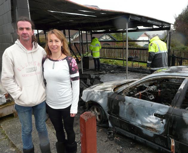 Balclutha couple Glenn Burns and Giselle Cooper take stock of the damage after a fire destroyed...