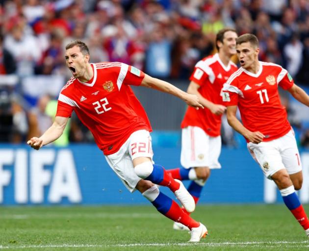 Artem Dzyuba celebrates scoring in Russia's win over Saudi Arabia at the football World Cup....