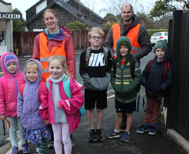 The walking school bus ready to go. Front (from left) Julia Hodgson (7) Penelope Hodgson (5) and Ava Scott (5). Middle (from left) Jen Hodgson, Eddie Panting (7), Henry Hodgson (4) Leo Cornelius (8). Back Richard Panting. Photo: Ella Stokes