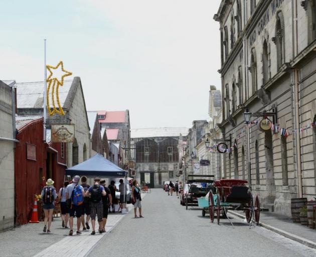 Tourists wander through Harbour St in Oamaru's Victorian Precinct. Photo ODT