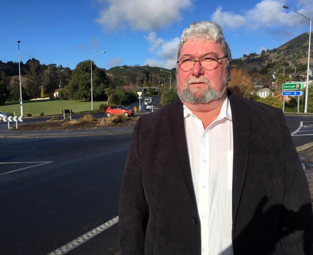 Mosgiel-Taieri Community Board member Martin Dillon wants blue and yellow carpet roses planted in the middle of a Mosgiel roundabout. Photo: Shawn McAvinue Mosgiel-Taieri Community Board member Martin Dillon wants blue and yellow carpet roses planted in the middle of a Mosgiel roundabout. Photo: Shawn McAvinue