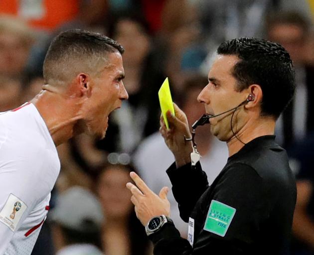 Cristiano Ronaldo reacts at referee Cesar Arturo Ramos
