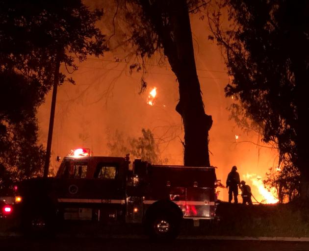 Firefighters work at the site of a wildfire in Goleta. Photo: Mike Eliason/Santa Barbara County...