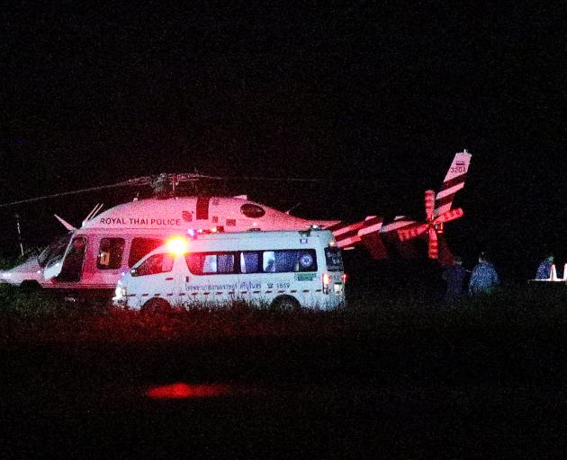 A Royal Thai Police helicopter carrying rescued schoolboys lands at a military airport in the...