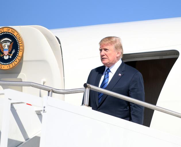 Trump deplanes Air Force One upon arrival in Morristown, New Jersey. Photo: Reuters