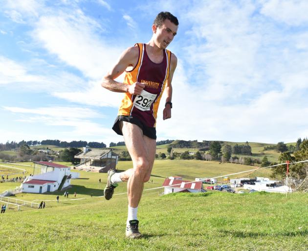 Daniel Balchin climbs a hill during his win at the Otago cross-country championships at the...