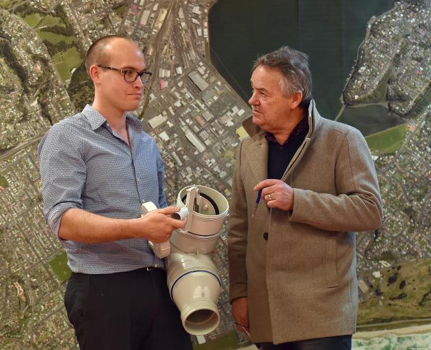 Dunedin City Council 3 Waters manager Tom Dyer explains the inner workings of a reflex valve to Greater South Dunedin Action Group president Ray Macleod at a public information session in South Dunedin yesterday. Photo: Peter McIntosh