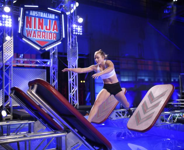 India Henry (22), formerly of Gore, jumps across obstacles during her Ninja Warrior run. Photo: Supplied