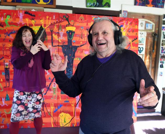 Sarah McDougall and artist Ewan McDougall in front of his artwork, The Way to Paradise, the inspiration for a jazz composition about to be toured in New Zealand. Photo: Stephen Jaquiery