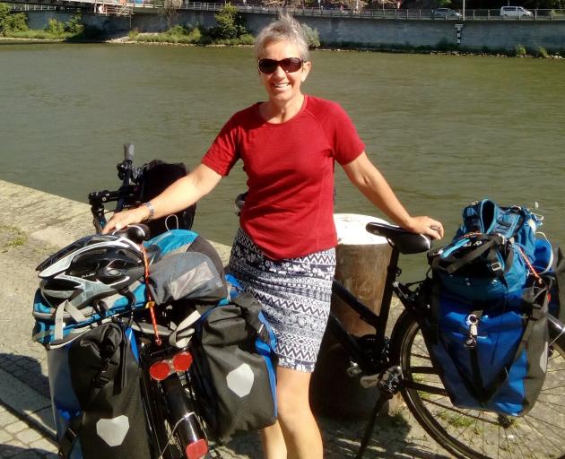 Jenny Malcolm stops for a photograph during a recent cycling tour in Europe. Photo: Supplied