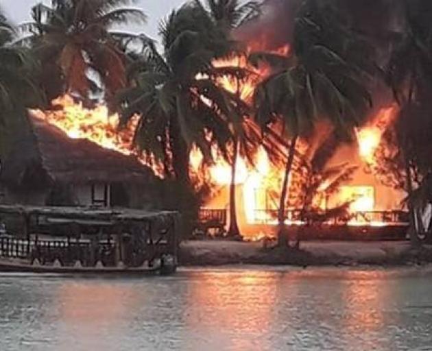 The Aitutaki Lagoon Resort & Spa up in flames. Photo: Annita Cyprien Drollet via NZ Herald