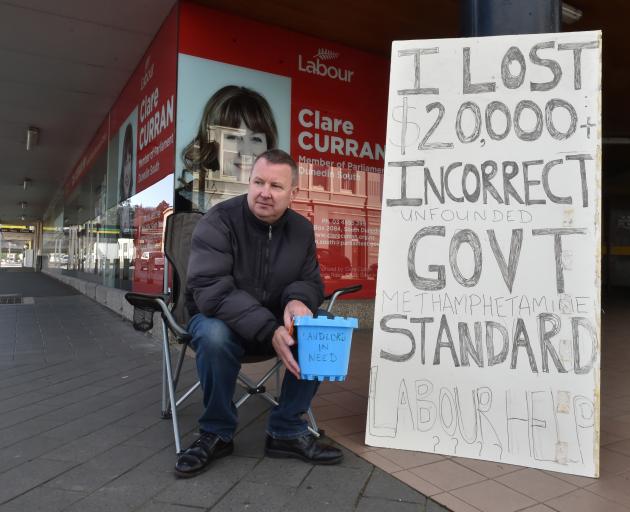 Otago landlord Mark Cowan protests outside Dunedin South MP Clare Curran's office yesterday about the lack of compensation for property owners who had their flats cleaned after they tested positive for methamphetamine. Photo: Gregor Richardson