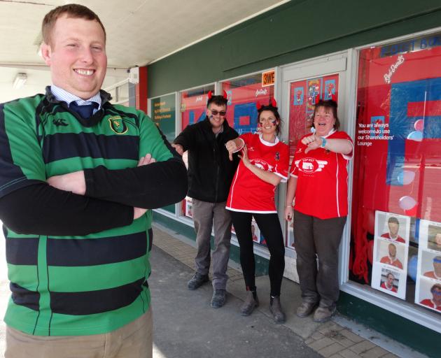 Maheno rugby player and Kurow resident Andrew Fisher is goaded by Kurow supporters (from left)...