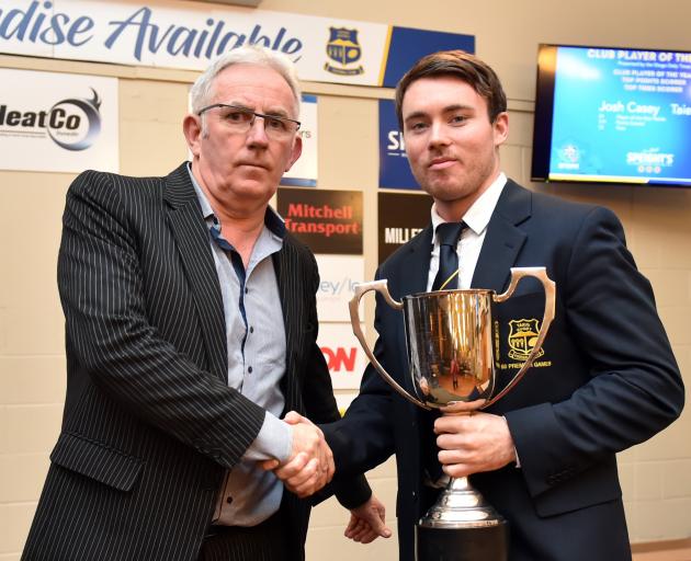 Otago Daily Times group sales manager Paul Dwyer (left) presents Josh Casey with the Dunedin...