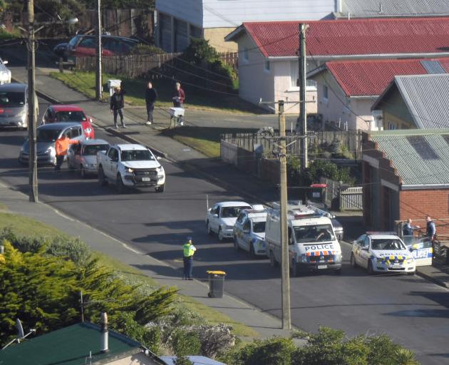 Cars queue behind a police cordon in Tomahawk about midday. Photo: Stephen Jaquiery