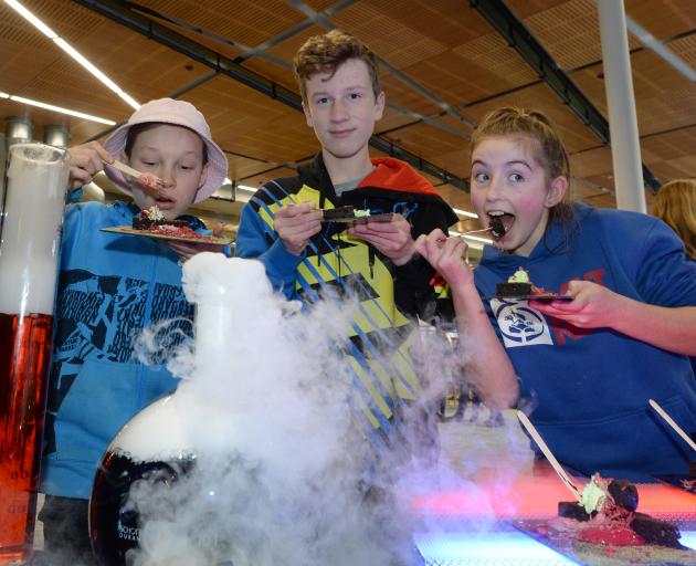 King's High School pupils Leo Etuata and Josiah Trounson (both 13), and Tahuna Normal Intermediate pupil Billie Askerud (12) enjoy chocolate brownies at Otago Polytechnic during a New Zealand International Science Festival event yesterday. Photo: Linda Ro