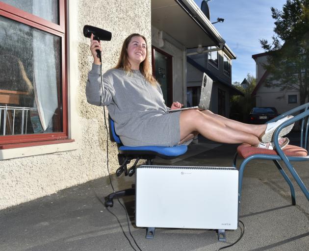 Harbour Tce resident Kacee Grant tries not to let regular power cuts faze her. Photo: Gregor Richarsdon