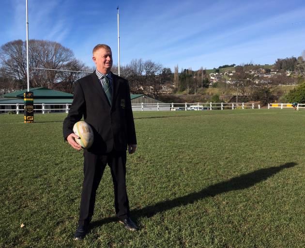 Green Island Rugby Football Club president Craig Anderson admires a dry rugby ground at Miller Park in Abbotsford on Saturday. Photo: Shawn McAvinue
