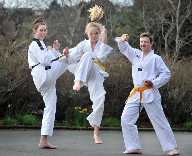 Kaikorai Valley College pupils (from left) Hanna Ingram (16), Jade Duffy-Maxwell (12) and James Loan (14) show off their skills at the school yesterday. Photo: Christine O'Connor