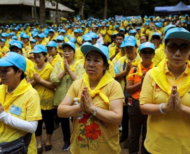 Mourners attend the funeral of former Thai navy diver, Samarn Kunan, who died during the rescue mission for the 12 boys of the "Wild Boars" soccer team. Photo: Reuters