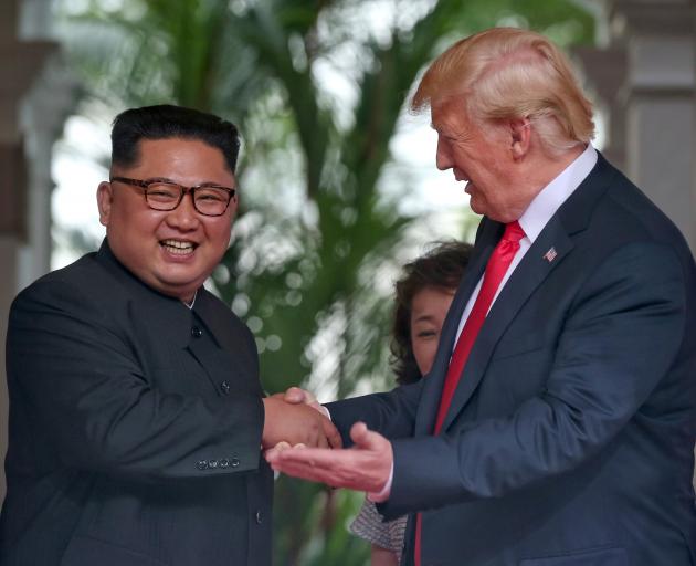 North Korean leader Kim Jong-Un and US President Donald Trump at their historic summit in...