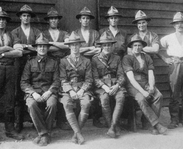 The 35th Reinforcements tug-o'-war team, winners of the championship at Suez Camp. Back row: L.-corp Townsend, Rflmn. Corner and McCallum, Corps. Campbell and Ford, L.-corp Slater, Corp Amos. Front row: Rflmn H. Healey (capt), Lieuts. Makeham and Fraser, 