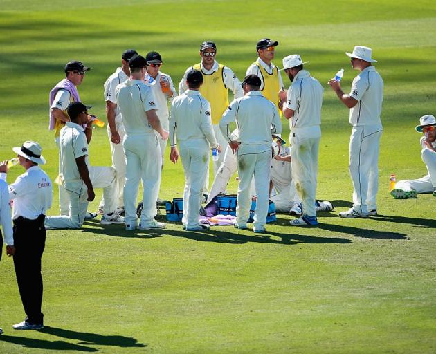 The Black Caps take a drinks break during their 2014 experience under the Abu Dhabi sun. Photo:...