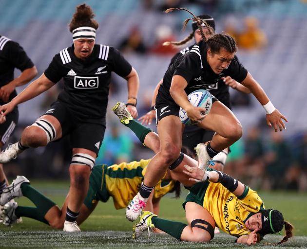  Theresa Fitzpatrick of the Black Ferns jumps over a Wallaroos defender. Photo: Getty Images