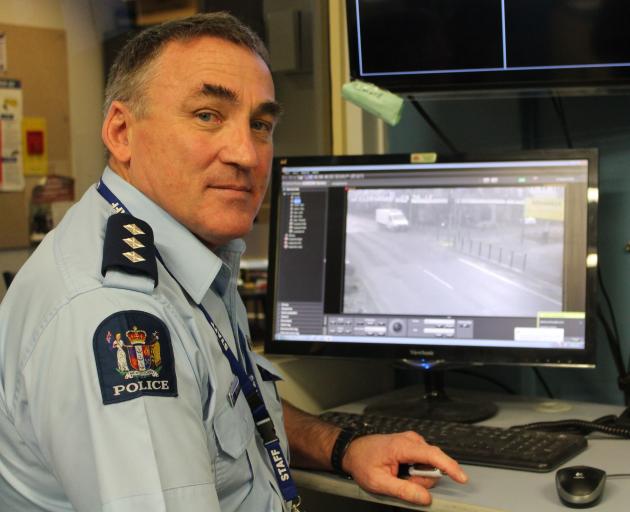Inspector Mike Bowman checks the quality of CCTV cameras overlooking Invercargill's CBD yesterday. Photo: Sharon Reece