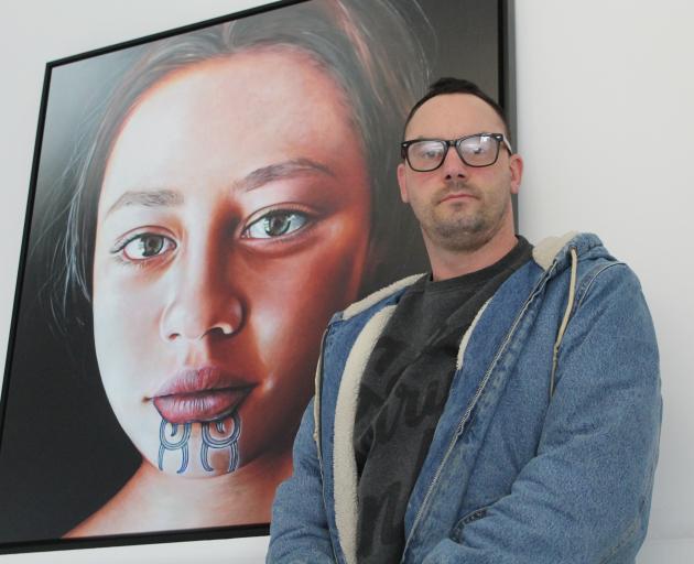 Invercargill artist Greg McDonald with his painting Descendant X, the subject of which will come...