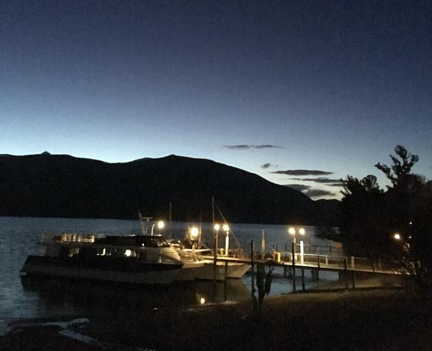 Sunset seemed so much later this far west, looking across Te Anau to the Kepler Mountains and the...