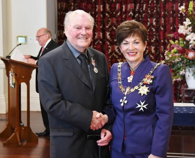 Greame Robertson receives the Queen's Service Medal from Govenor-General Dame Patsy Reddy in 2016...