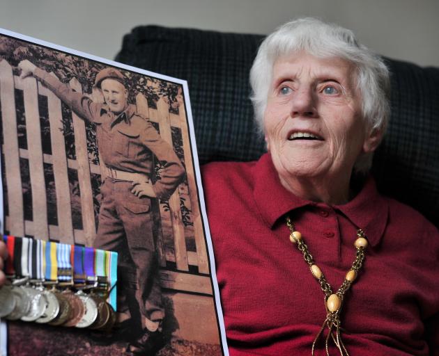 Dunedin resident Kathy Wright holds a photograph of her late brother SAS Corporal Allister (`...