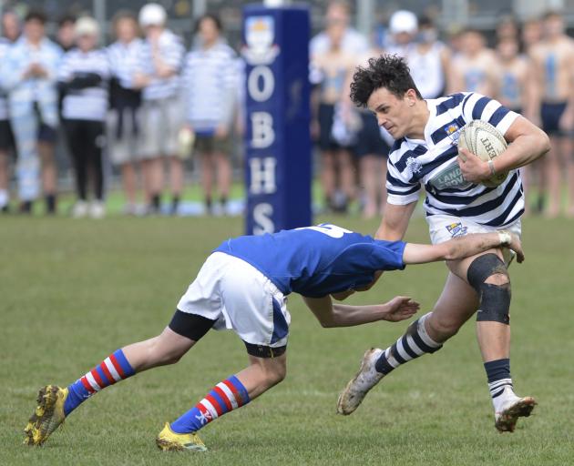 Otago Boys’ High School centre Jake Te Hiwi tries to outstep Southland Boys’ High School opposite...