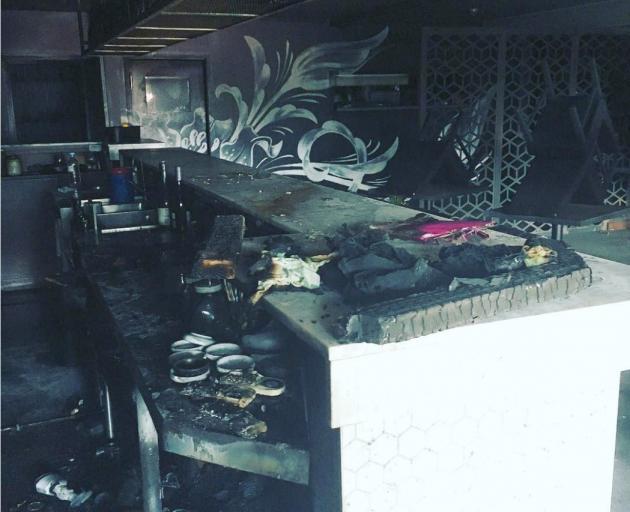 It is believed tea towels under the bar (pictured) caused the fire at Ode restaurant on Sunday...