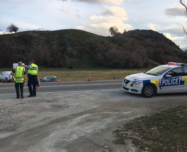 Police attend the scene of an traffic incident near Arrowtown this afternoon. Photo: Joshua Walton