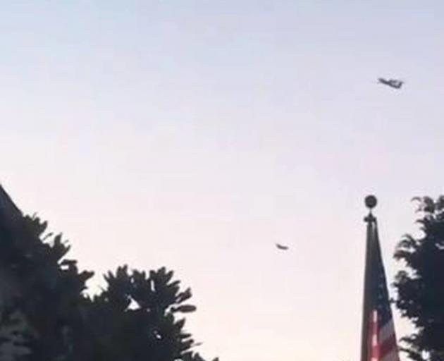 The stolen plane is followed by a military jet. Photo: via Twitter