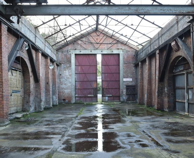 Since its asbestos-based roof was removed by the Dunedin City Council last year, the century-old Sims Building in Port Chalmers has been exposed to the elements. Photo: Gregor Richardson