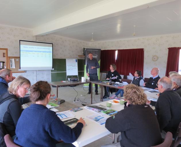 Otago Regional Council's Bruce Monaghan, of Alexandra, takes farmers attending the Beef + Lamb New Zealand Land Environment Plan workshop, held in Millers Flat two weeks ago, through the council's environmental requirements. Beside him is Judy Miller, a s
