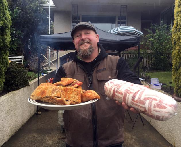 Dave Neilson, of Dunedin, celebrates ‘‘Bacon Day’’ with friends on Friday last week with pork creations including deep-fried crackling wrapped in bacon and a ‘‘bacon explosion’’ — pork mince, bacon and barbecue sauce wrapped in streaky bacon and then bak Dave Neilson, of Dunedin, celebrates ‘‘Bacon Day’’ with friends on Friday last week with pork creations including deep-fried crackling wrapped in bacon and a ‘‘bacon explosion’’ — pork mince, bacon and barbecue sauce wrapped in streaky bacon and then bak