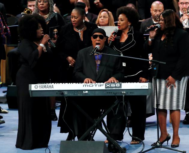 Stevie Wonder performs at the funeral service for the late singer Aretha Franklin at the Greater...