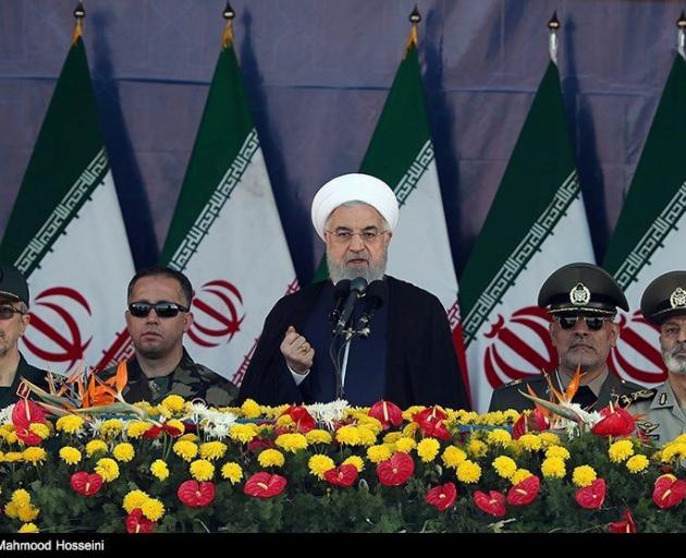 Iranian President Hassan Rouhani delivers a speech during the annual military parade in Tehran....