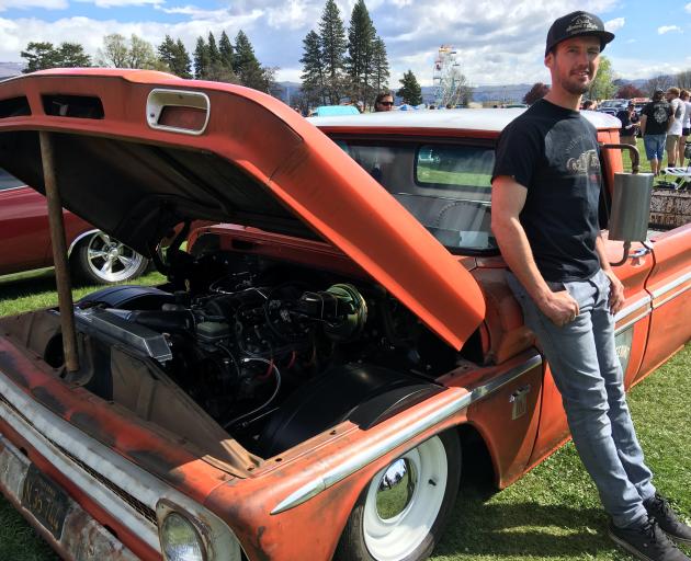 Todd Sutherland, of Alexandra, shows off his modified 1964 Chevrolet C10 pickup at the Alexandra...