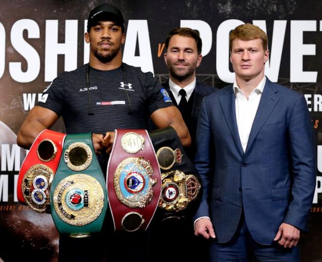 Anthony Joshua (left), Eddie Hearn (middle) and Alexander Povetkin at the press conference prior...