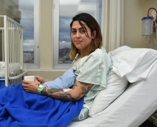 Recovering in Dunedin Hospital yesterday, Ashley Rolleston had just placed her baby in her car...