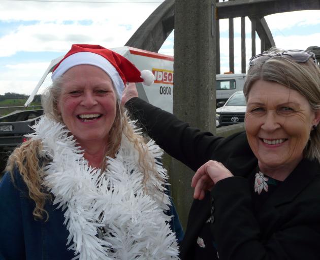 Clutha District Council community support and development adviser Jean Proctor (right) has handed over co-ordination of the Clutha Country Christmas Parade to a new team led by Clinton businesswoman Jo-anne Thomson (left). Photo: Richard Davison