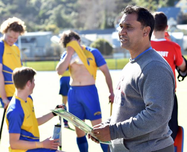 Southern Dogs coach Clive Daniels directs the action during his side’s warm-up game against...