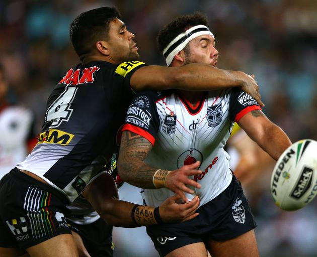 Jazz Tevaga of the Warriors is tackled during the NRL Elimination Final match between the Penrith...