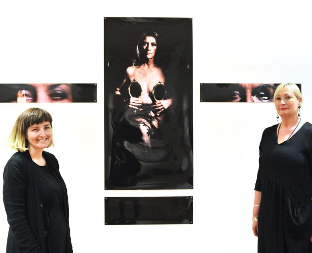 Hocken curator art, Andrea Bell (left) and head curator pictorial collections Robyn Notman flank a work by former Frances Hodgkins’ Fellow Christine Webster. The work has been included in the ‘‘Sisters Communing’’ exhibition to celebrate 125 since women w